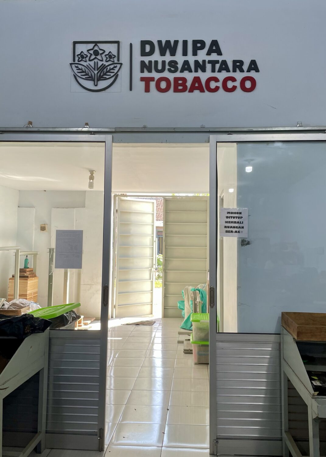 Dwipa Nusantara Tobacco office entrance with open sliding door.