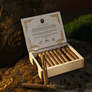 Cigars in wooden box with batik fabric and coffee beans.